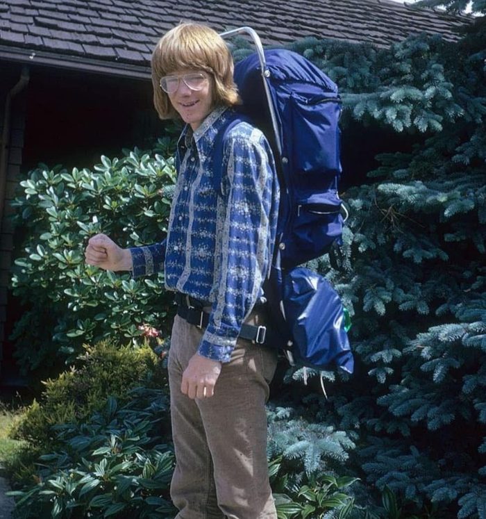 Ryan as a teenager with a large blue backpack